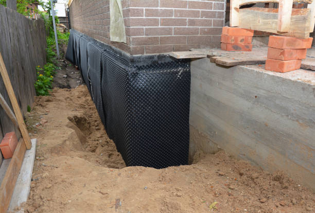 Happy homeowners after waterproofing job in Hope Hull